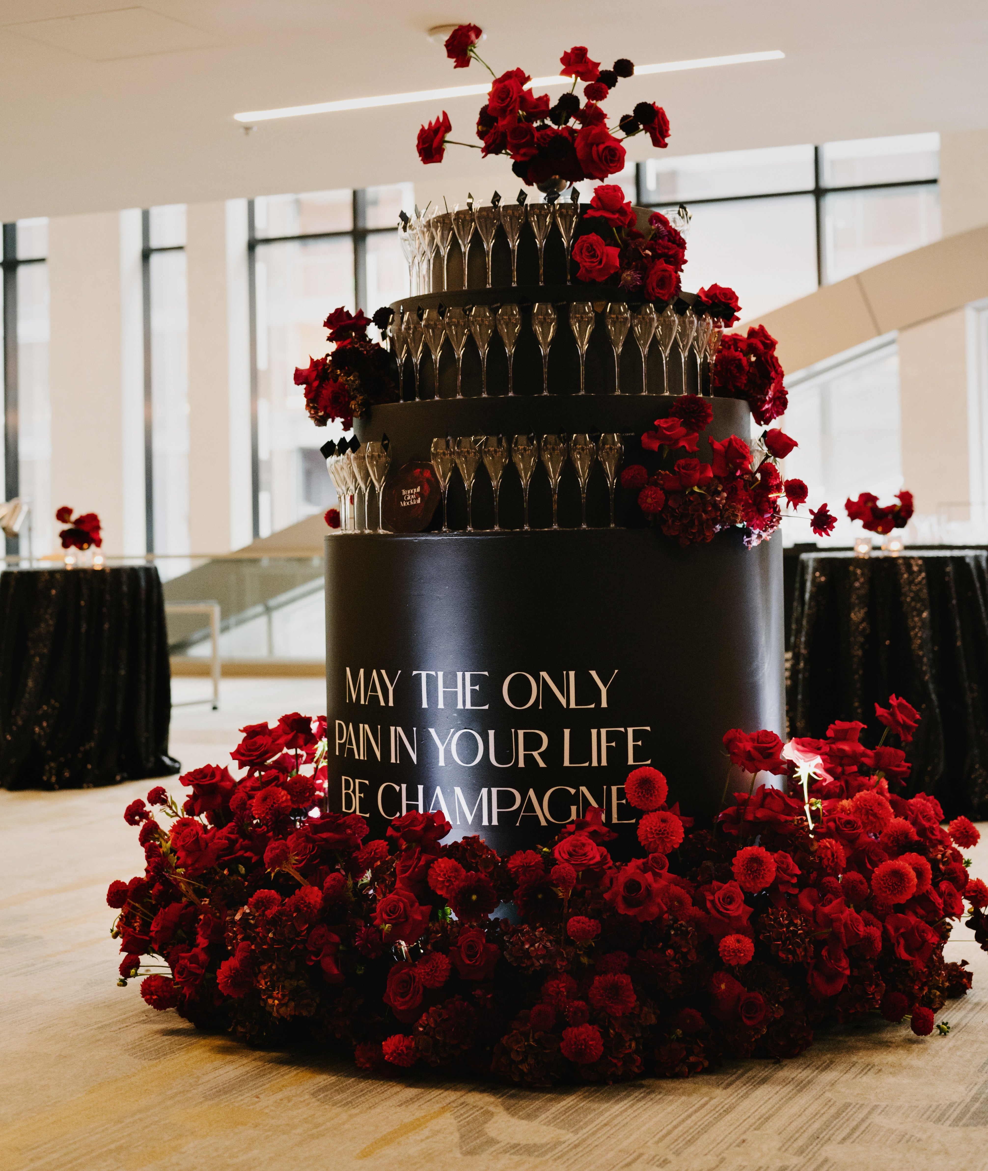 Custom architectural tower signage and branded bar design for an elevated event. Bespoke structural stationery that serves as a high-impact focal point and directional guide for guests.