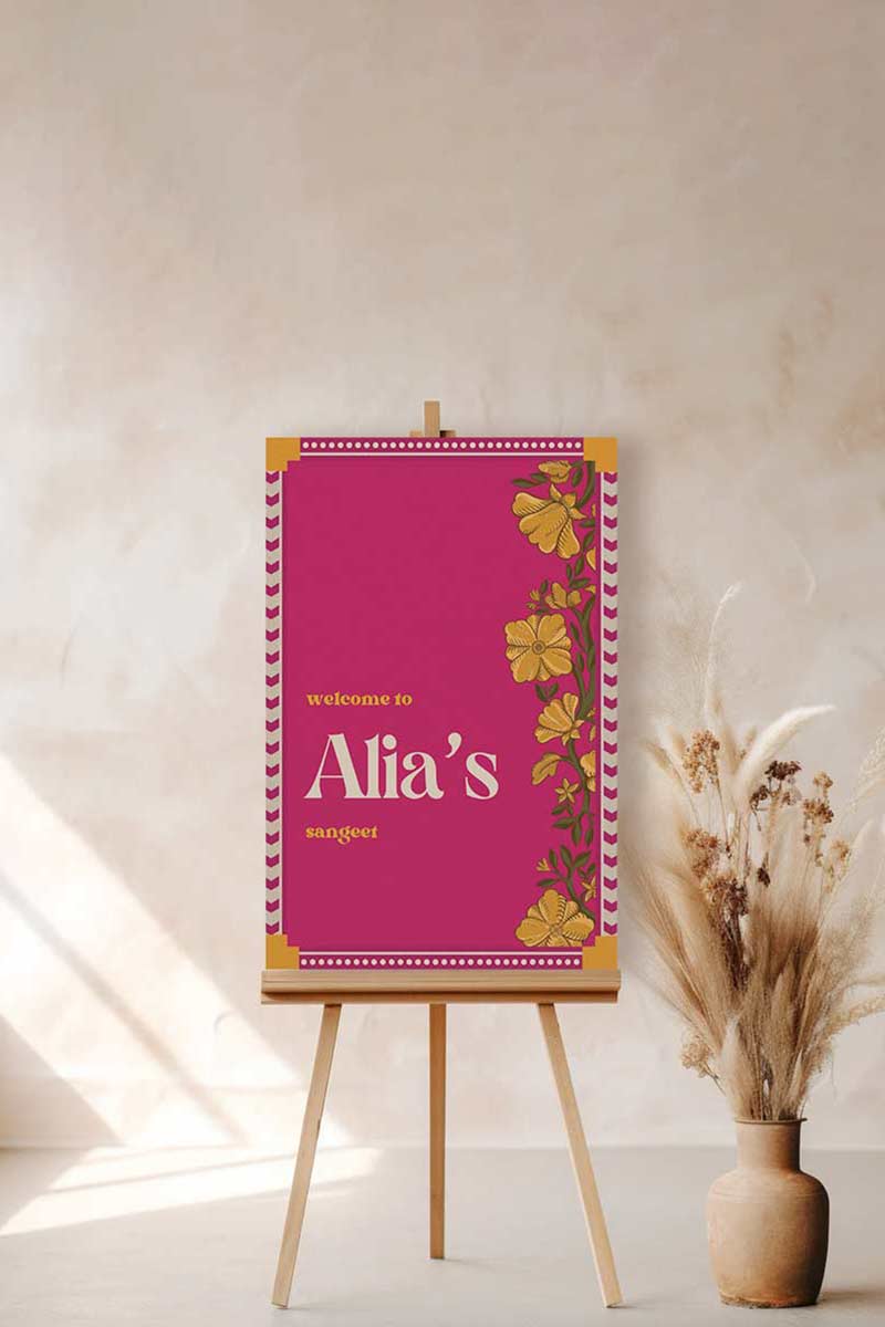 Retro Wedding Welcome Sign with florals in the shades of hot pink, yellow, and beige. Indian Wedding Events like jago, sangeet, mehndi, haldi, chunni & maiyan. Personalize and customize in Canva. Print at any local printer around the World.
