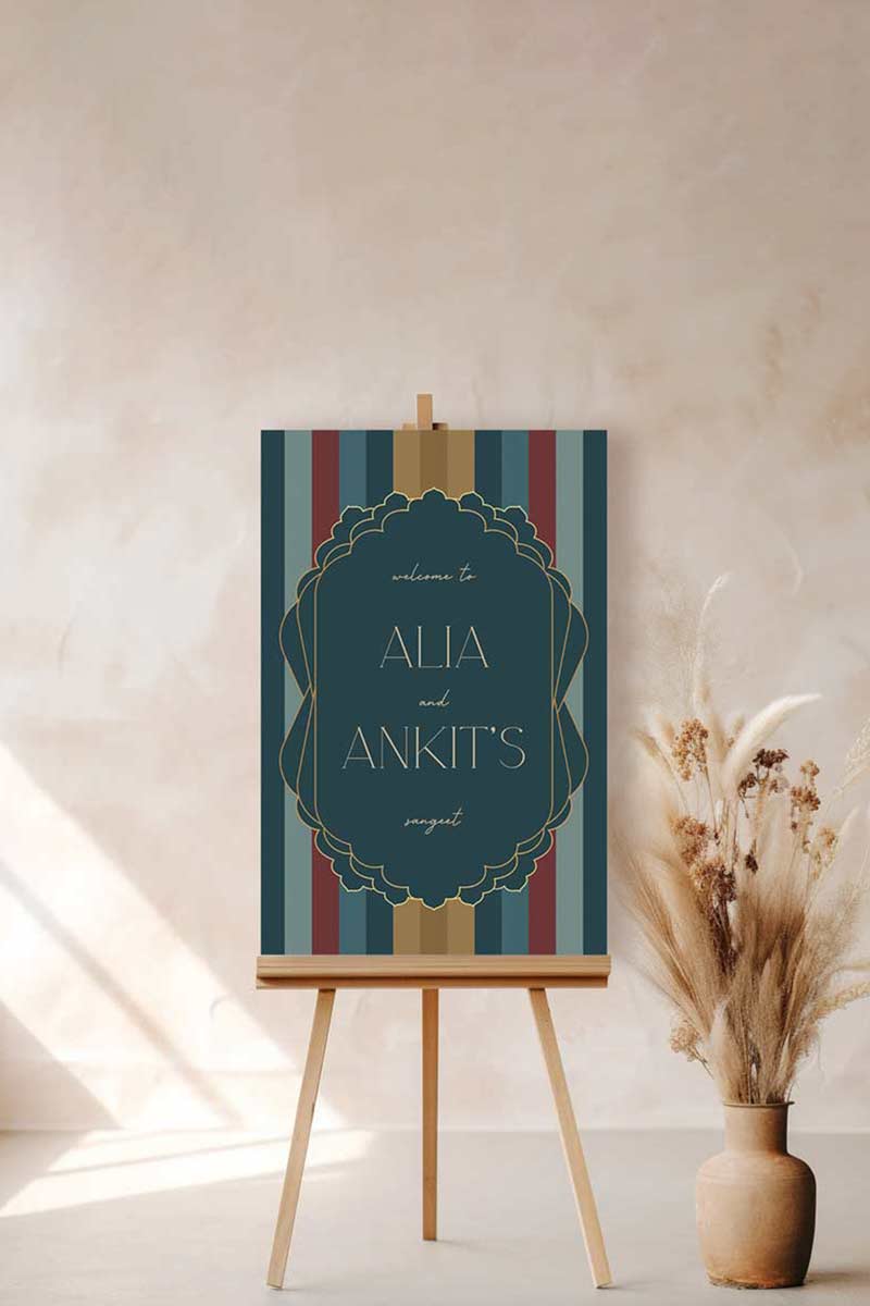 Modern Wedding Welcome Sign with stripes in the shades of blue, red, yellow & gold. Sabyasachi. Indian Wedding Events like jago, sangeet, mehndi, haldi, chunni & maiyan. Personalize and customize in Canva. Print at any local printer around the World.