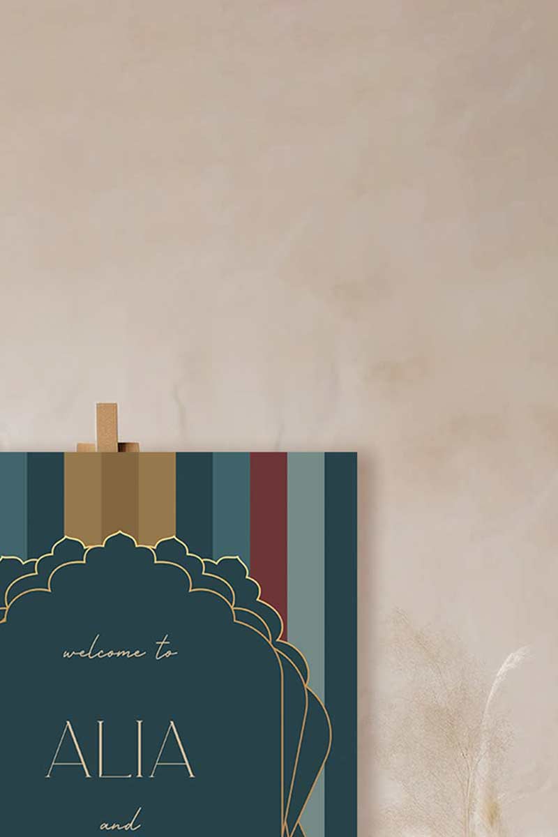 Modern Wedding Welcome Sign with stripes in the shades of blue, red, yellow & gold. Sabyasachi. Indian Wedding Events like jago, sangeet, mehndi, haldi, chunni & maiyan. Personalize and customize in Canva. Print at any local printer around the World.