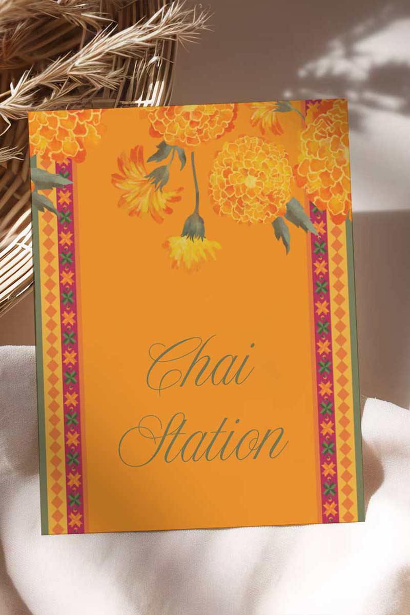 Wedding Stationery Sign with marigold florals in the shades of yellow, orange & green phulkari. Bangle Station, Bindi Bar, Jhumka Bar, Mehndi Station, Chai Station. Personalize and customize in Canva. Print at any local printer around the World.