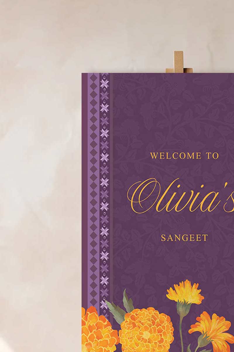 Wedding Welcome Sign with marigold florals in the shades of purple, yellow, & orange. phulkari. Indian Wedding Events like jago, sangeet, mehndi, haldi, chunni & maiyan. Personalize and customize in Canva. Print at any local printer around the World.