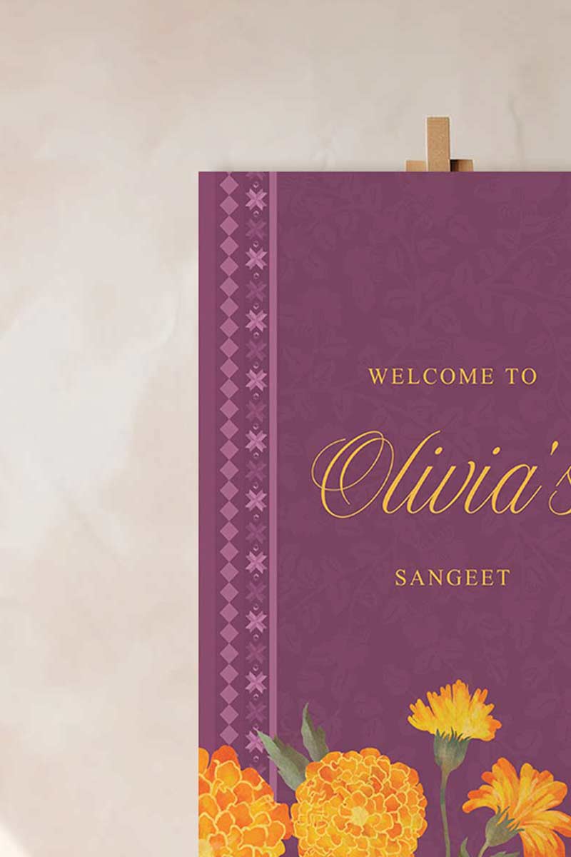Wedding Welcome Sign with marigold florals in the shades of purple, yellow, & orange. phulkari. Indian Wedding Events like jago, sangeet, mehndi, haldi, chunni & maiyan. Personalize and customize in Canva. Print at any local printer around the World.