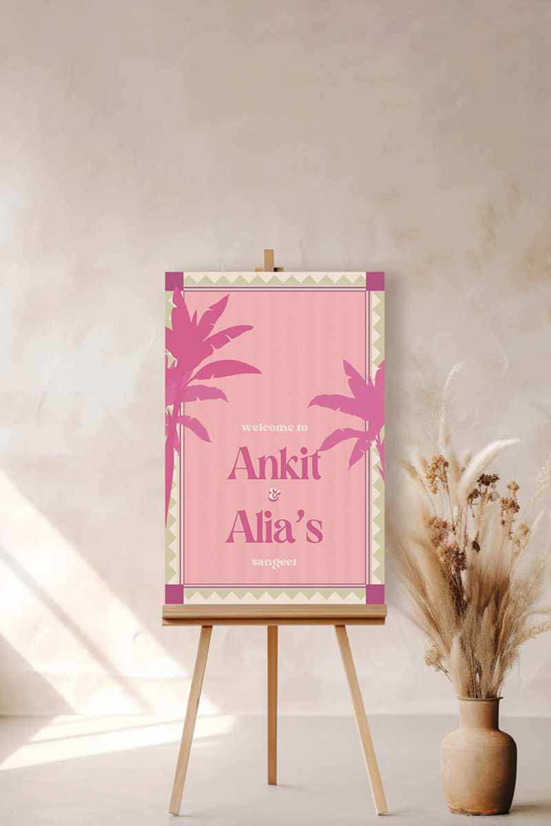 Retro Tropical Palm Tree Wedding Welcome Sign with pink & purple palm trees. In the shades of baby pink, hot pink, green & beige. Tropical Jungle theme event. Indian Wedding Events like engagement, baby shower, bridal shower, jago, sangeet, mehndi, haldi, wedding & maiyan. Personalize and customize in Canva. Print at any local printer around the World.