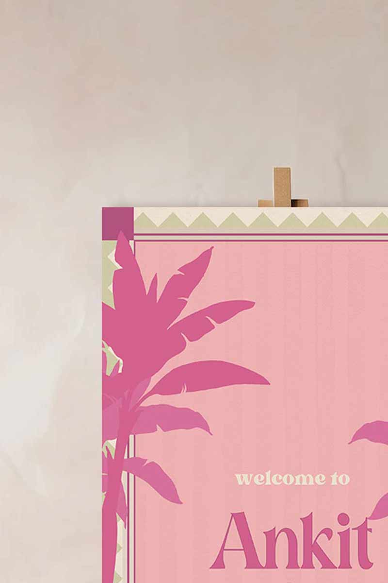 Retro Tropical Palm Tree Wedding Welcome Sign with pink & purple palm trees. In the shades of baby pink, hot pink, green & beige. Tropical Jungle theme event. Indian Wedding Events like engagement, baby shower, bridal shower, jago, sangeet, mehndi, haldi, wedding & maiyan. Personalize and customize in Canva. Print at any local printer around the World.