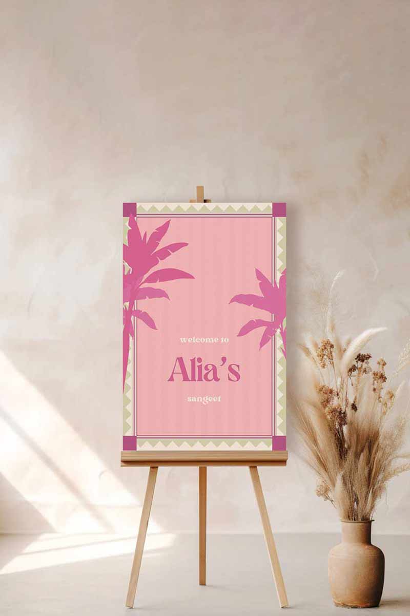 Retro Tropical Palm Tree Wedding Welcome Sign with pink & purple palm trees. In the shades of baby pink, hot pink, green & beige. Tropical Jungle theme event. Indian Wedding Events like engagement, baby shower, bridal shower, jago, sangeet, mehndi, haldi, wedding & maiyan. Personalize and customize in Canva. Print at any local printer around the World.