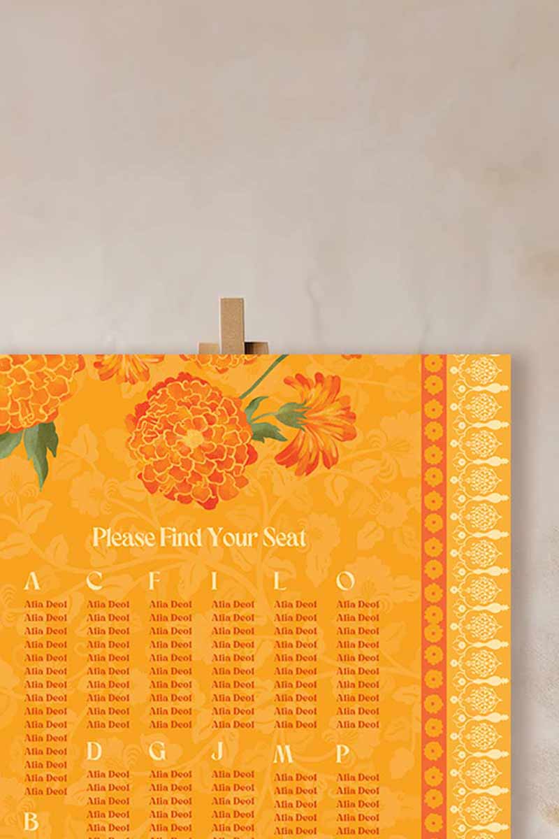 Wedding Seating Chart with yellow & orange marigold florals. Indian Wedding events for Sangeet, Haldi, Maiyan or Jago. Find your seat. Wedding Signage. Personalize and customize in Canva. Digital Download.  Print around the world at a local print shop.