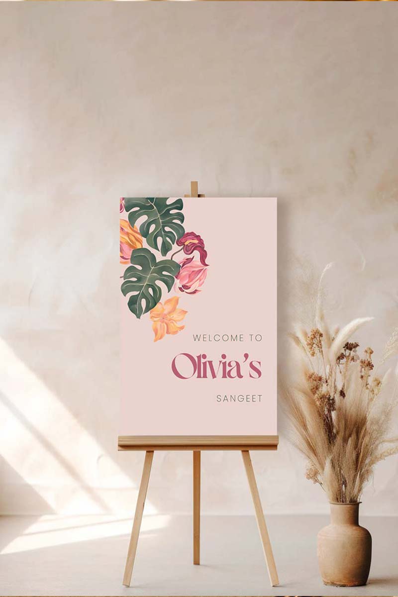 Tropical foliage & floral Wedding Welcome Sign. In the shades of pink, hot pink, green, teal, orange, yellow, forest green & beige. Tropical Jungle theme event. Indian Wedding Events like engagement, baby shower, bridal shower, birthday, jago, sangeet, mehndi, haldi, wedding & maiyan. Personalize and customize in Canva. Print at any local printer around the World. Digital Canva Template