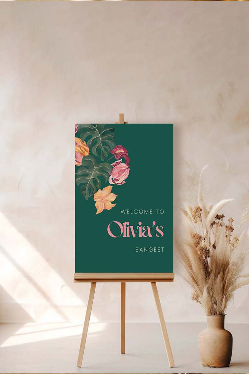Tropical foliage & floral Wedding Welcome Sign. In the shades of pink, hot pink, green, teal, orange, yellow, forest green & beige. Tropical Jungle theme event. Indian Wedding Events like engagement, baby shower, bridal shower, birthday, jago, sangeet, mehndi, haldi, wedding & maiyan. Personalize and customize in Canva. Print at any local printer around the World. Digital Canva Template