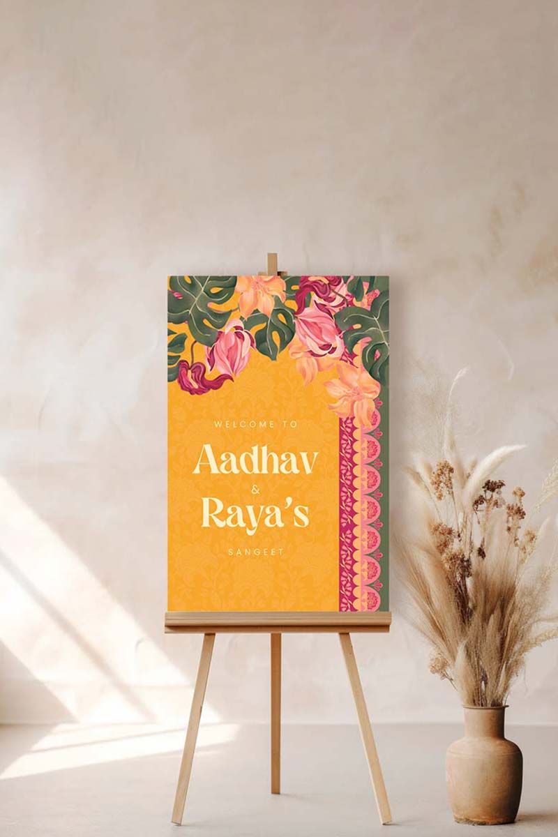 Orange, yellow & pink tropical floral Wedding Welcome Sign with orange marigold florals. Pink roses. Traditional Indian wedding sign. Indian Wedding events for Sangeet, Haldi, Maiyan or Jago. Wedding Signage. Personalize and customize in Canva. Digital Download.  Print around the world at a local print shop.