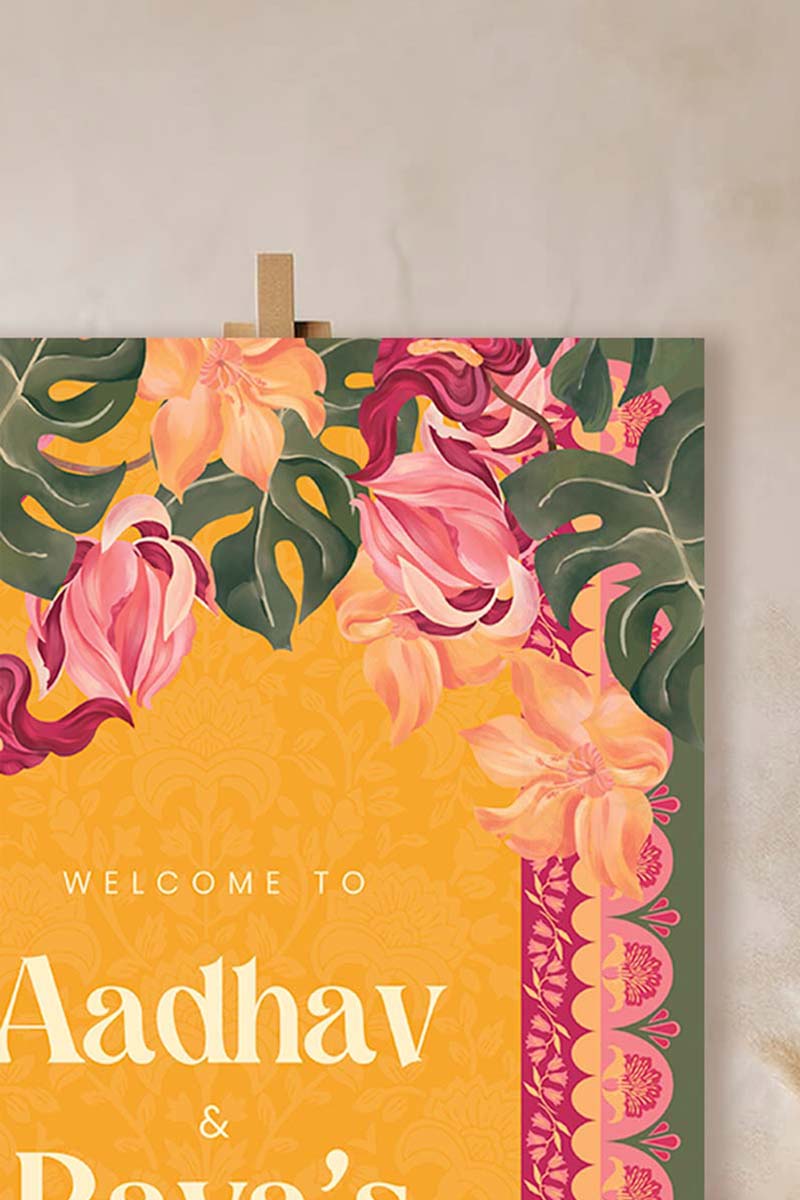 Orange, yellow & pink tropical floral Wedding Welcome Sign with orange marigold florals. Pink roses. Traditional Indian wedding sign. Indian Wedding events for Sangeet, Haldi, Maiyan or Jago. Wedding Signage. Personalize and customize in Canva. Digital Download.  Print around the world at a local print shop.