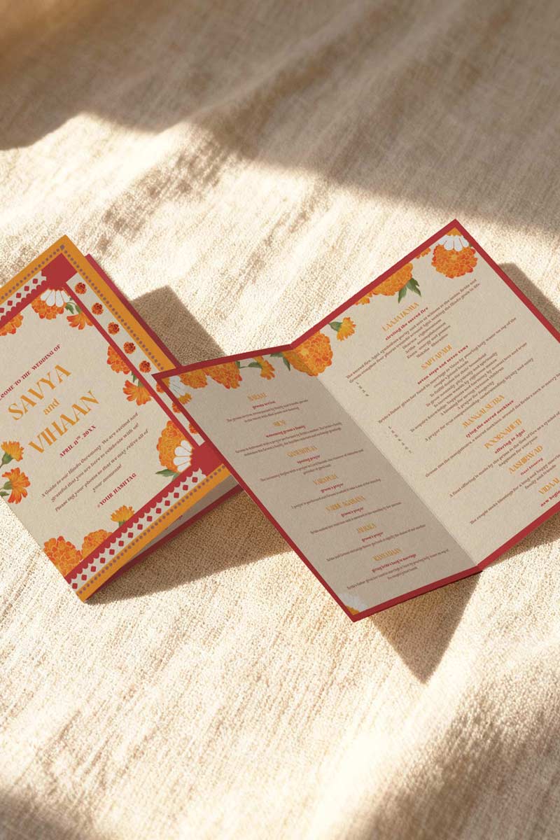 Retro Marigold Wedding folded program card in the shades of red, orange, green, and white. With orange, red & yellow florals. Jaipur block print artwork. It is inspired by the retro Indian era style design and art. Sized at 5" x 7" with front and back design options. Indian Wedding Invitation Set. Personalize and customize in Canva. Print at any local printer around the World. Florals & Birds